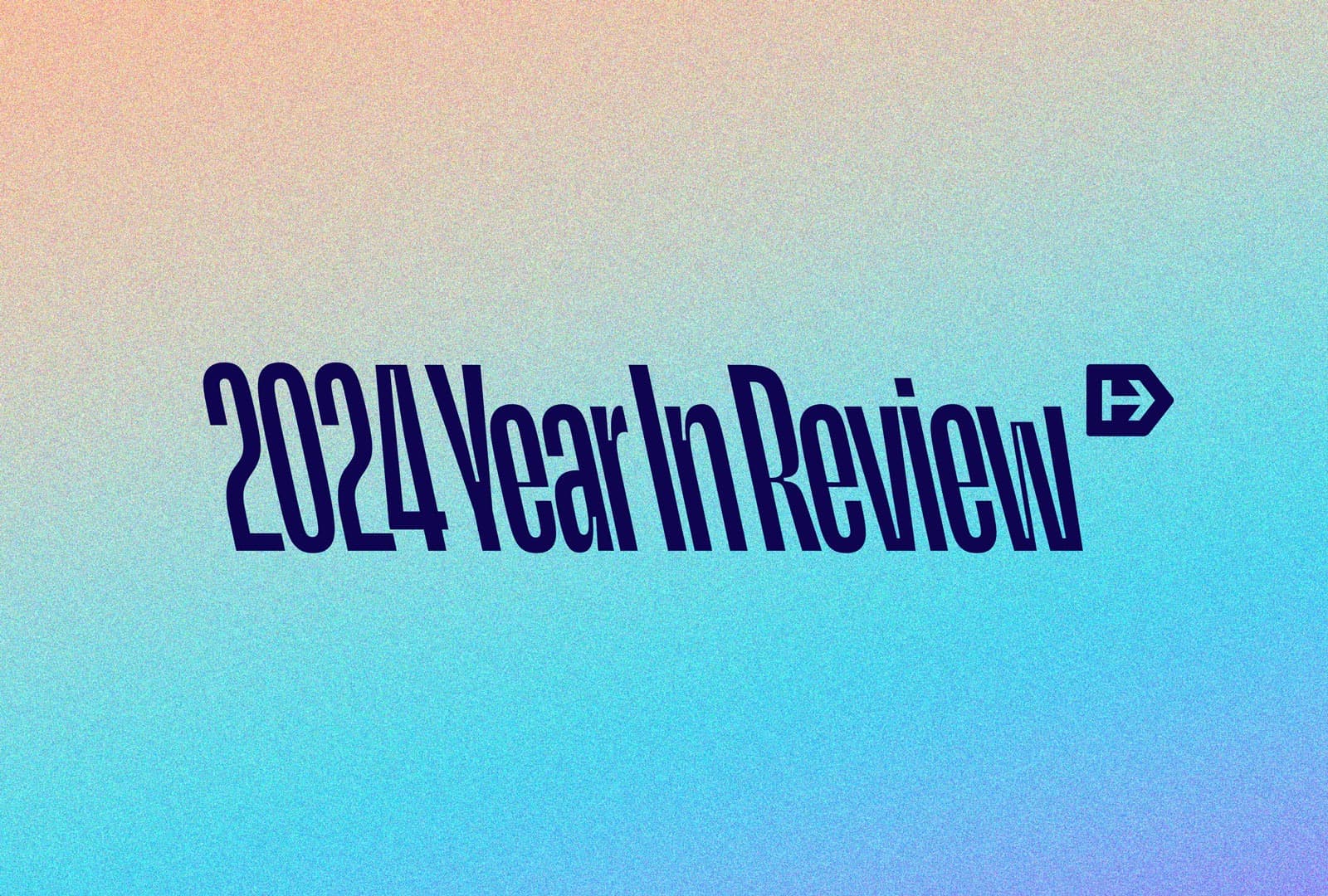 The image features the text "2024 Year In Review" in bold, dark blue letters on a gradient background transitioning from peach to blue. An arrow symbol follows the text.