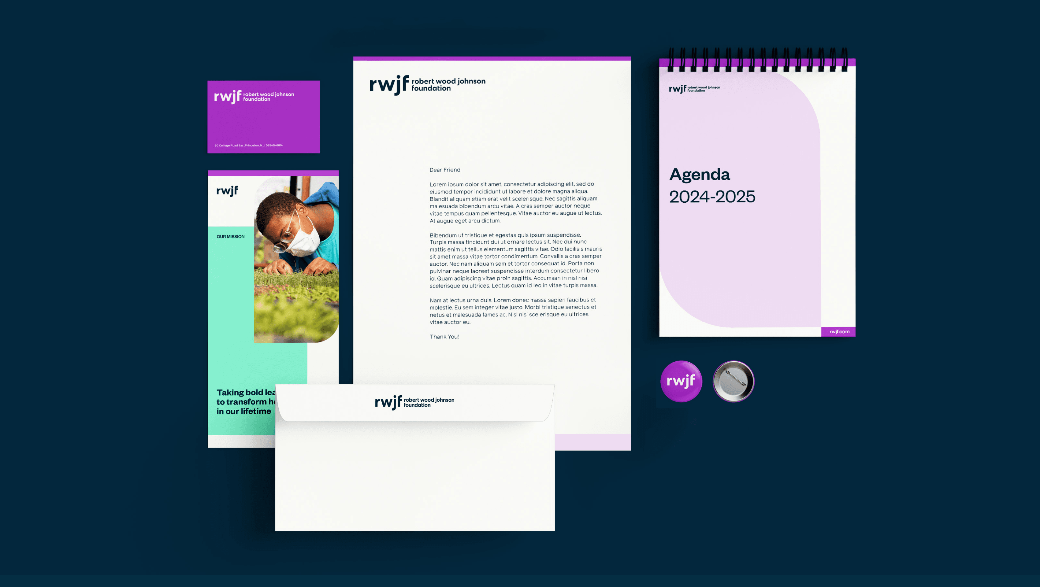A collection of stationary items on a dark background, including a branded business card, a flyer with a photo of a child planting, a letterhead with text, a spiral-bound agenda labeled "Agenda 2024-2025," an envelope, a badge, and a circular pin, all branded with "rwjf.
