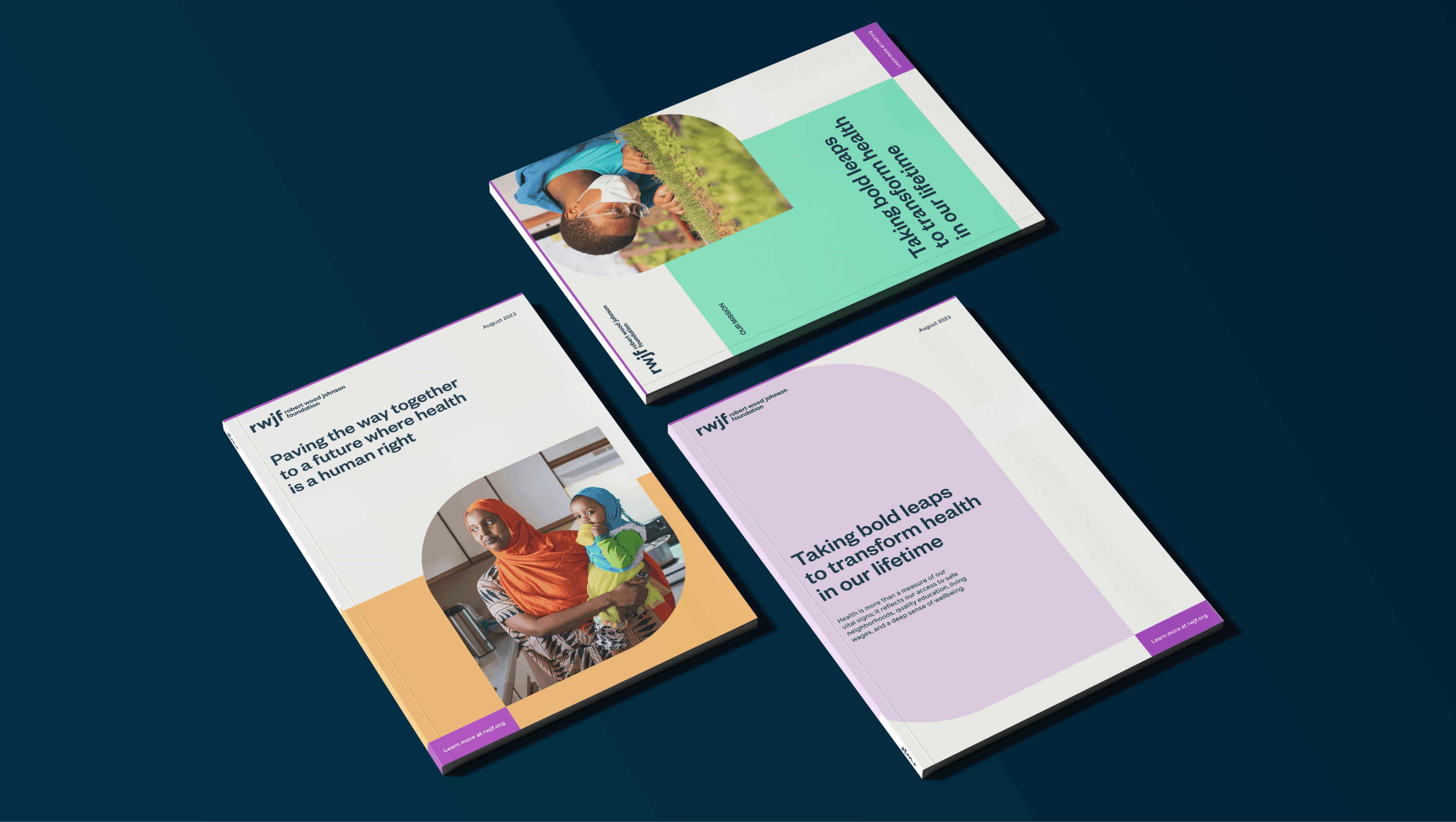 Three colorful booklets are laid out on a dark blue surface. Each booklet features different cover images and text. The texts on the covers are: "Providing the very highest standards of health is a human right.", "Taking bold leaps to transform health in our lifetime.", and "Taking bold leaps to transform health in our lifetime.