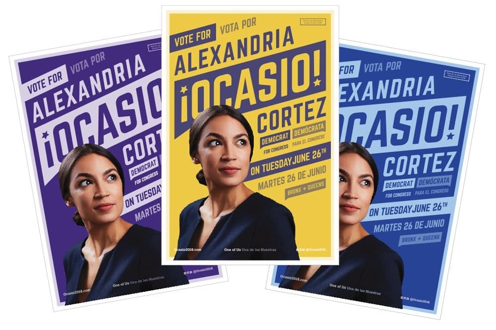 Three campaign posters featuring Alexandria Ocasio-Cortez with a backdrop in shades of purple, yellow, and blue. The text includes slogans in English and Spanish, urging voters to support her on Tuesday, June 26th. She is looking confidently into the distance.